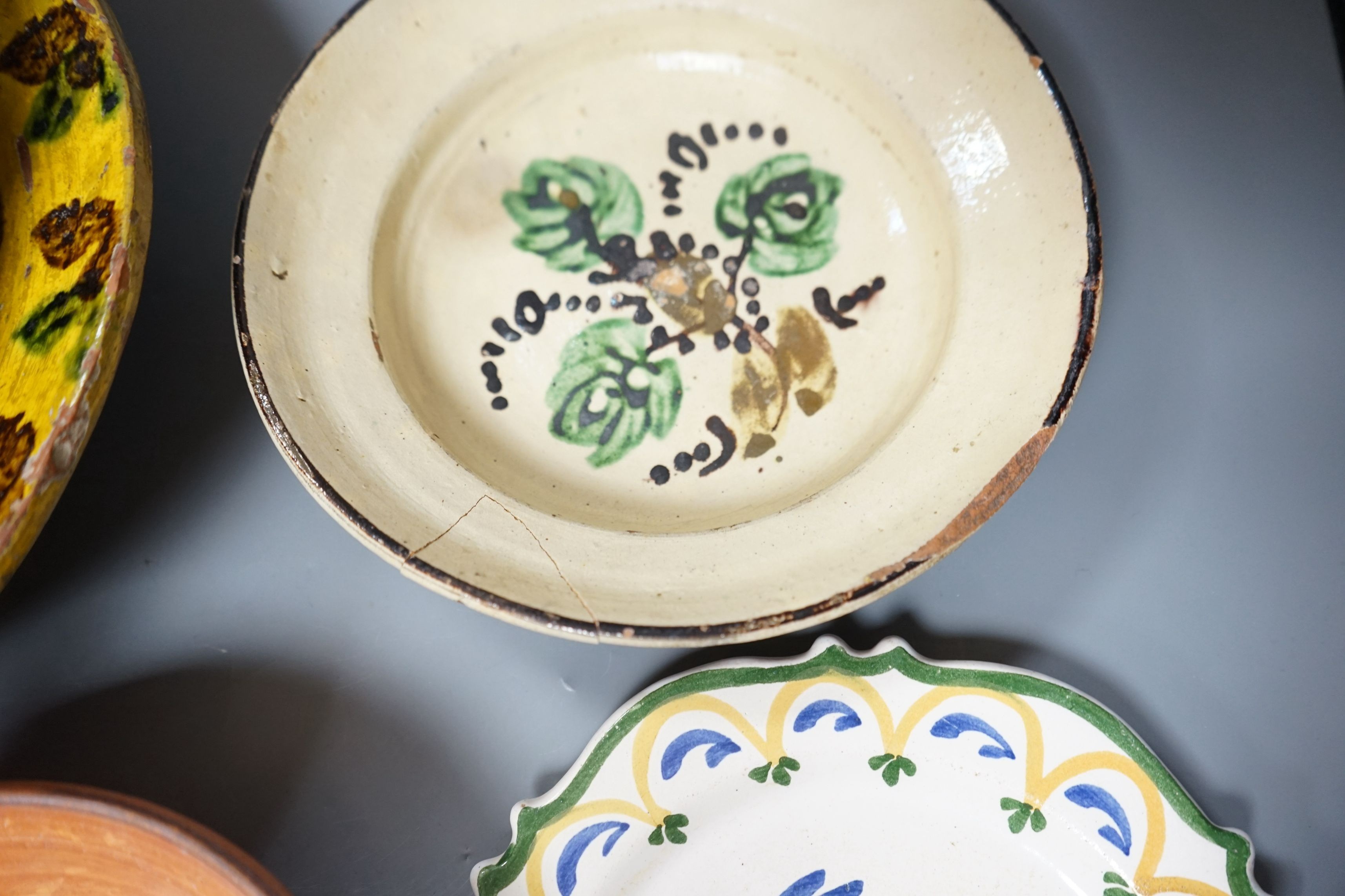 A group of 19th/20th century Continental pottery items to include two sponge ware dishes and a partially glazed jar, largest 20cm, (6)